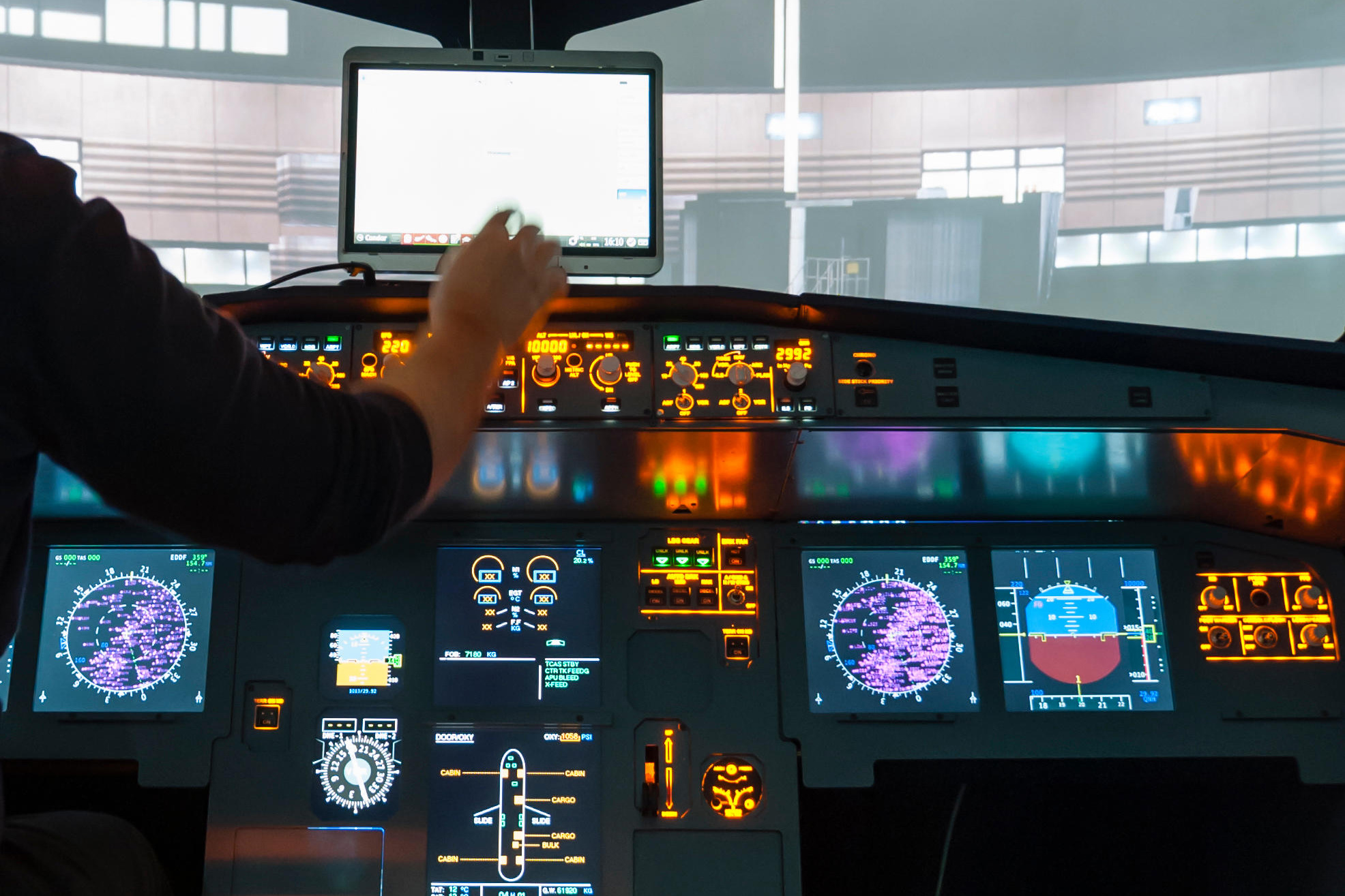 Cockpit of an Airbus A320 flight simulator that is used for training of professional airline pilots (preparing for takeoff)